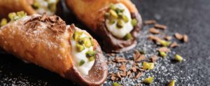 chocolate dipped cannoli with pistachio