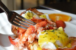 Lobster roll with poached eggs